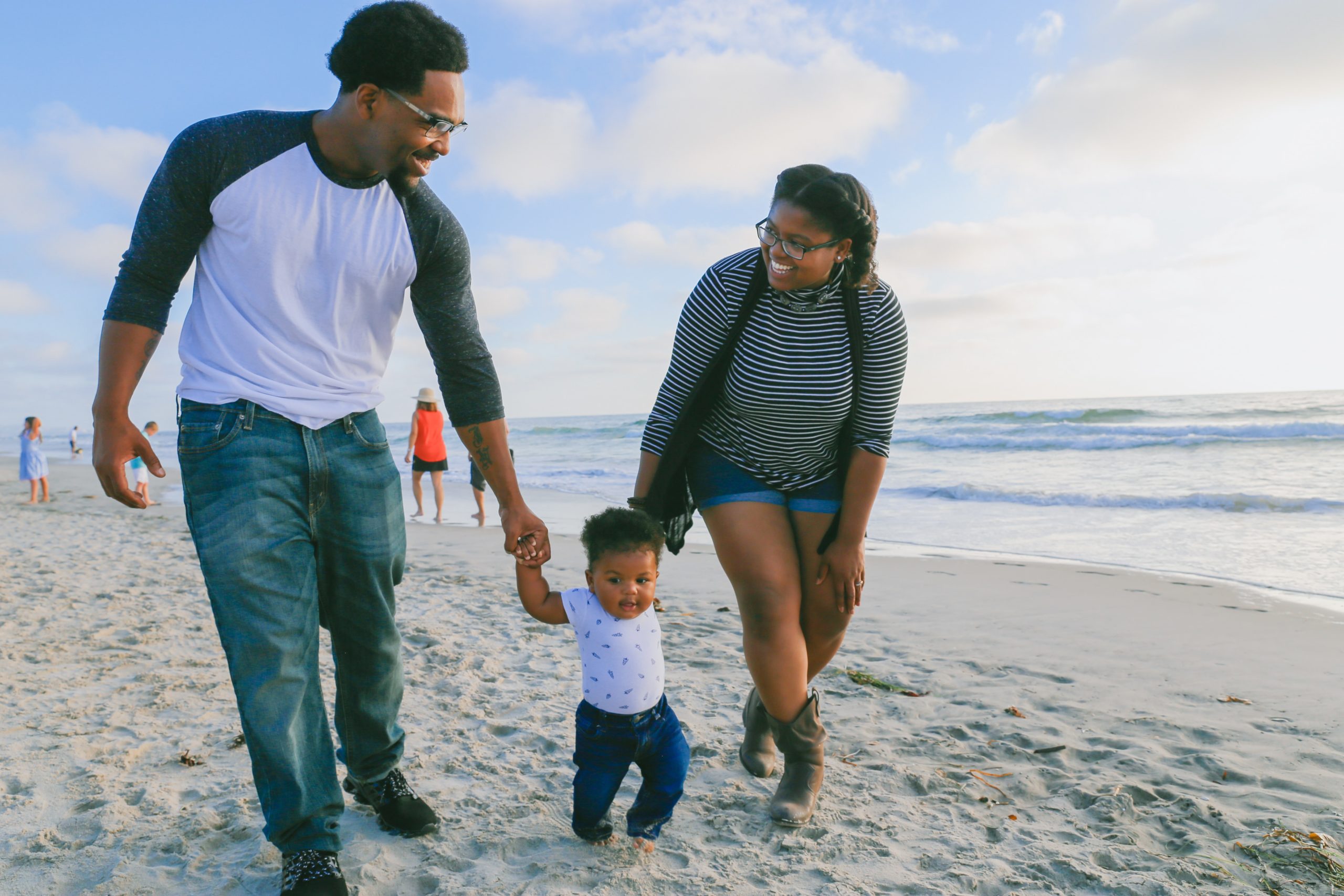 family on a beach discussing personal financial planning